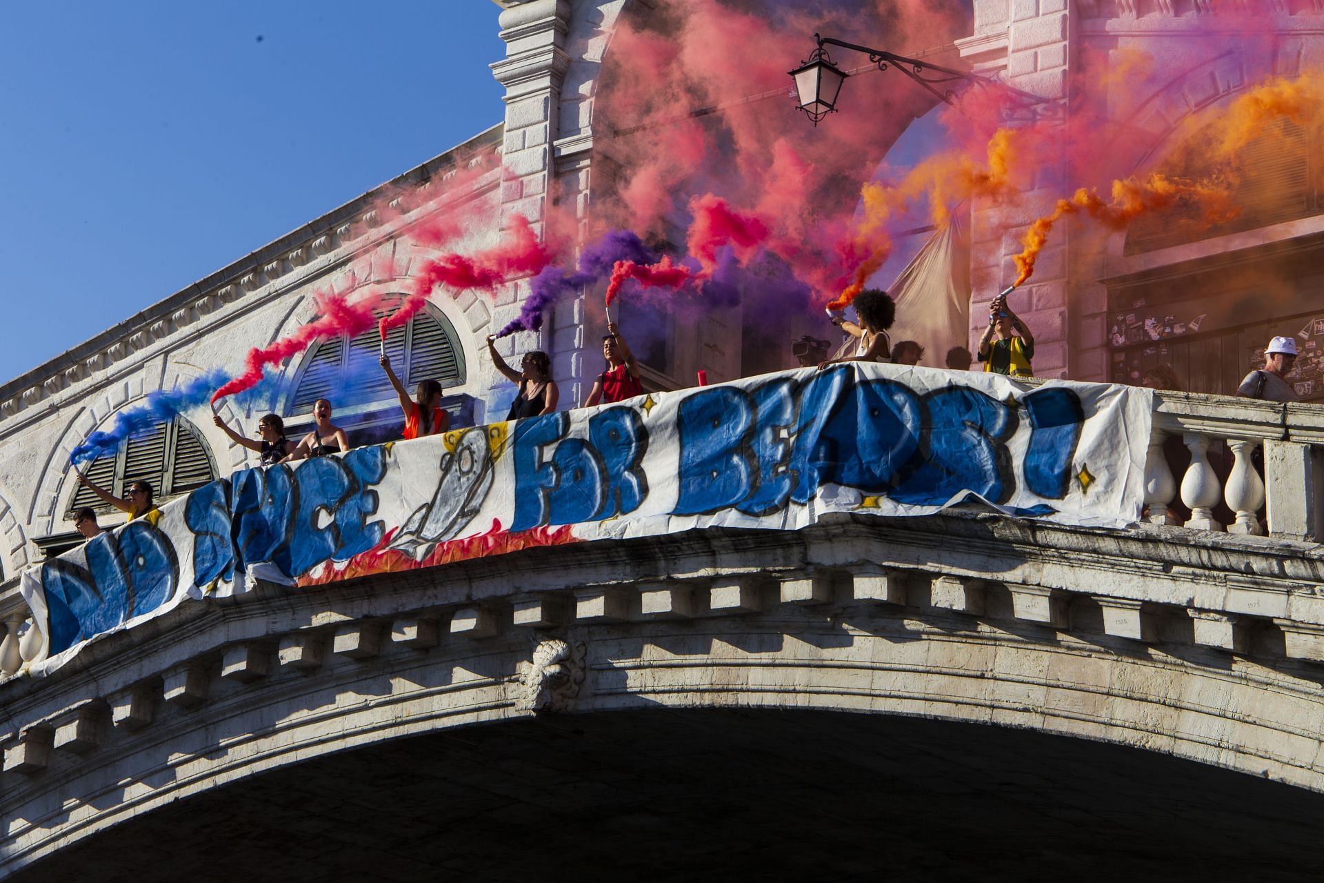 Protestors against the wedding of Jeff Bezos march in Venice (Image via Getty )